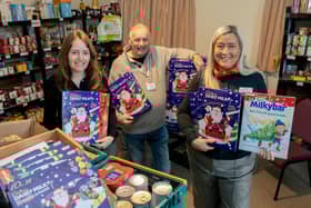 Marketing manager Olivia Stephenson (left) and sales manager Helene Key (right) , with Boston Foodbank manager Bob Taylor.