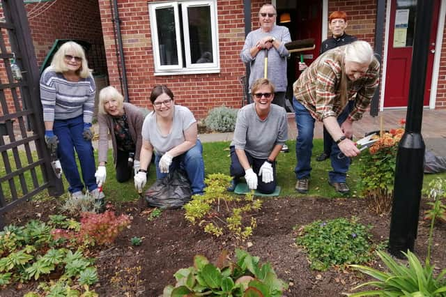 Customers getting together to plant a neglected area to improve it visually and encourage socialisation.