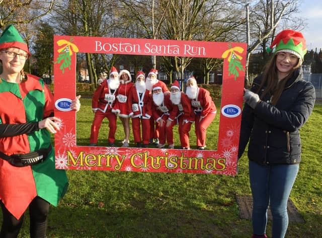 The ‘Elfie Selfie’ proved popular - pictured here framing a group of Santas as they prepare to take part in the run. Photos by David Dawson.