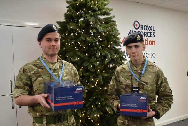Christopher Dickinson and Joshua Jackson with festive hampers. EMN-211214-132827001