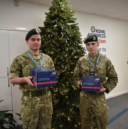 Christopher Dickinson and Joshua Jackson with festive hampers. EMN-211214-132827001