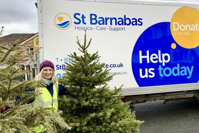 Louise Cotton with trees the hospice has previously recycled.