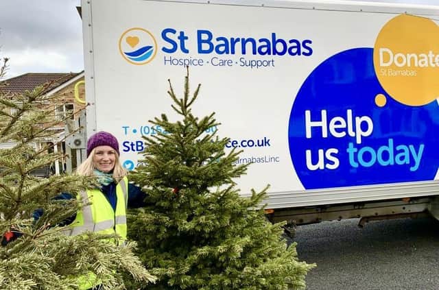 Louise Cotton with trees the hospice has previously recycled.