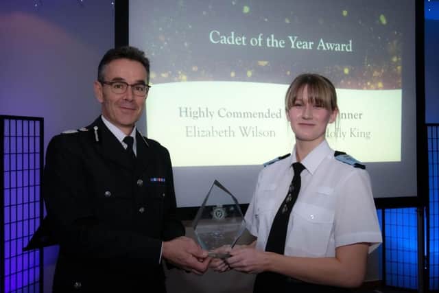 Boston Police Cadet Holly King accepts her award.
