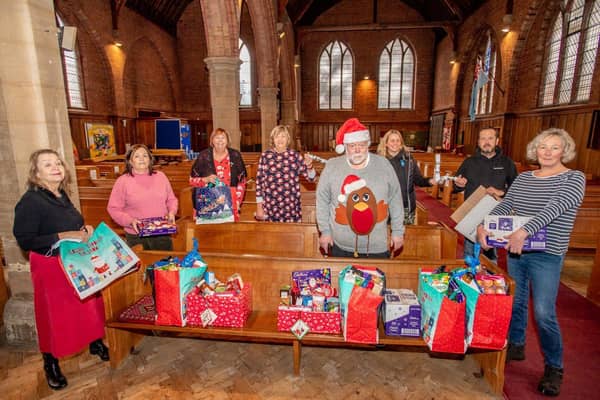 Woodhall Spa and Kirkby on Bain Food Bank's volunteers assembling festive parcels. EMN-211220-111317001