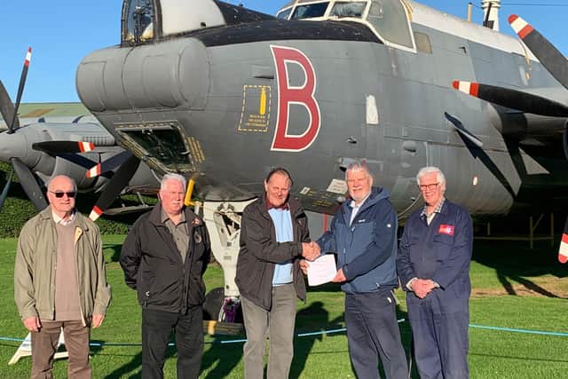Representatives of Newark Air Museum and the Lincolnshire’s Lancaster Association sign paperwork confirming the ownership of the Avro Shackleton, WR977 and the Avro Vulcan, XM594 being immediately transferred to NAM. EMN-211215-153607001