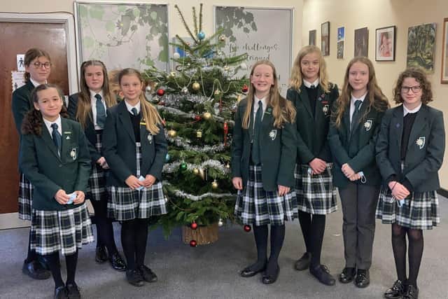 Kesteven and Sleaford High School Year 7 form prefects who decorated the school tree with decorations including messages from students and staff for loved ones no longer with us. EMN-211216-170752001