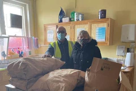Bob Field of the Rotary Club of Skegness delivering food to Sue Alldread, of Wainfleet Methodist Church.