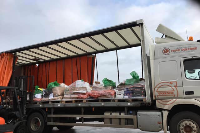 Food donated by Buckingham Emergency Foods arriving at RG & SR Oglesbee of Boston. The Rotary Club of Skegness collected the donations for the Big Christmas Feasts at Wainfleet Methodist Church and the Storehouse in Skegness.