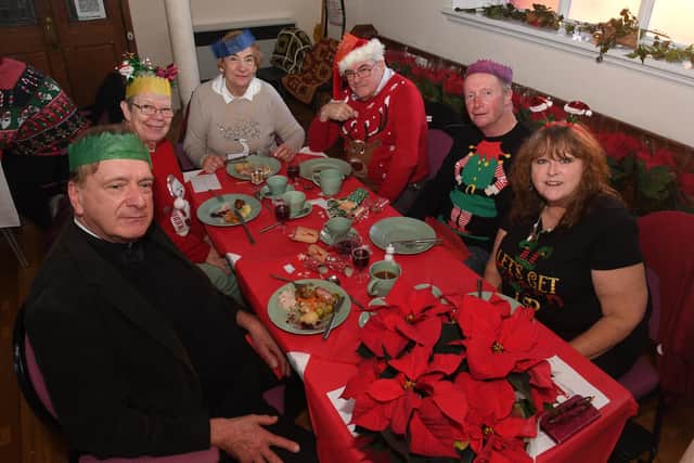 Father Huw (left) joined the Big Christmas Feast at Wainfleet. He is pictured with Pat Nicholas, Susan Howard, Peter Nicholas, Nick Jones and Beth Jones.