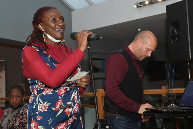 Bamidele Akomolafe, of Lunch Box 5000 at the Storehouse, welcoming guests to the Big Christmas Feast.