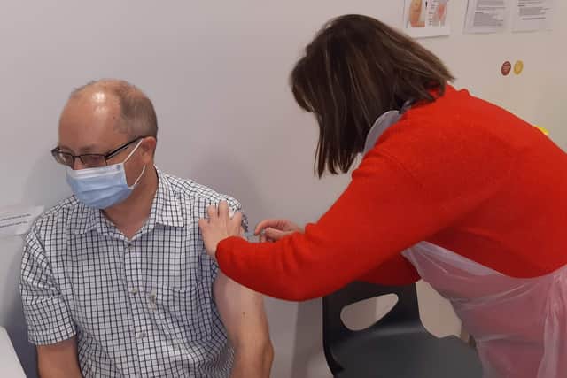 The Sleaford Standard's Andy Hubbert - and his wife, Jo, both turned up for their booster jabs on the day of the 250,000th vaccination milestone at Grantham Meres Leisure Centre. EMN-211217-160040001