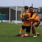 Kyron Gordon helps Jake Wright jnr celebrate his opener in the 4-1 FA Trophy win against Kidderminster Harriers. Photo: Oliver Atkin