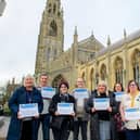 Seven of the winners pose with their certificates outside Boston Stump. Photos: Chris Vaughan Photography.