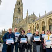 Seven of the winners pose with their certificates outside Boston Stump. Photos: Chris Vaughan Photography.