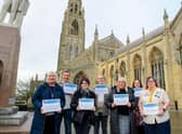 Seven of the winners pose with their certificates outside Boston Stump. Photos: Chris Vaughan Photography.