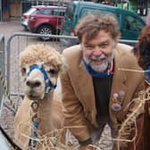 Coun Bunney with the alpacas that were a popular feature at this year’s pop-up markets EMN-211220-093332001