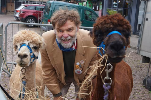 Coun Bunney with the alpacas that were a popular feature at this year’s pop-up markets EMN-211220-093332001