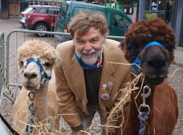Coun Bunney with the alpacas that were a popular feature at this year’s pop-up markets EMN-211220-093332001