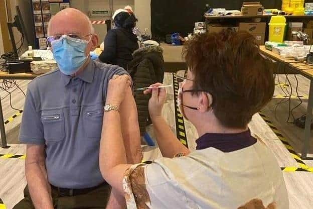 John Sampson, 80, of Skegness, became the first patient in Skegness to receive the Covid-19 vaccine from advanced nurse practitioner Jane Spence, of Orby, who had come out of retirement to help.