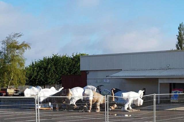 Dinosaurs being stored in Skegness ahead of being installed at the former Model Village site in Skegness.