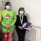 Ashdene Care Home manager Jilly Hunt (centre) with gifts for Age UK visitor hosts, Clare (left) and Anne (right). EMN-211221-174235001