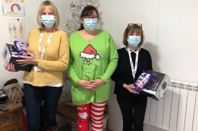 Ashdene Care Home manager Jilly Hunt (centre) with gifts for Age UK visitor hosts, Clare (left) and Anne (right). EMN-211221-174235001