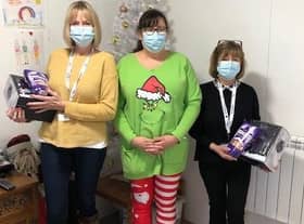 Ashdene Care Home manager Jilly Hunt (centre) with gifts for Age UK visitor hosts, Clare (left) and Anne (right). EMN-211221-174235001