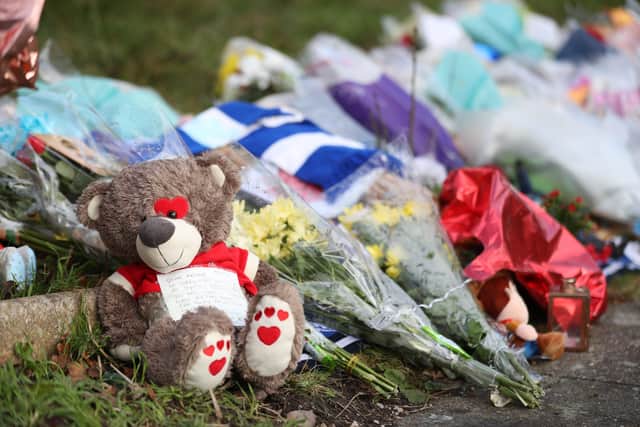 Tributes left outside the home of Arthur Labinjo-Hughes in Solihull, West Midlands. Almost 100 child cruelty offences were recorded by Lincolnshire Police during the first year of the coronavirus pandemic, figures show. Photo: PA EMN-211224-161449001