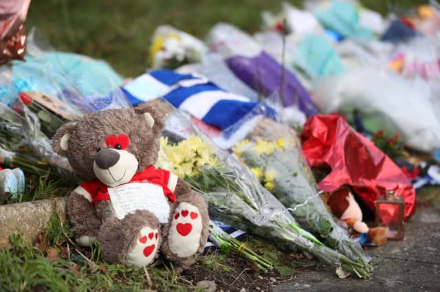 Tributes left outside the home of Arthur Labinjo-Hughes in Solihull, West Midlands. Almost 100 child cruelty offences were recorded by Lincolnshire Police during the first year of the coronavirus pandemic, figures show. Photo: PA EMN-211224-161449001