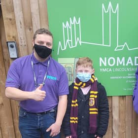 Ethan meets some of the team at the YMCA in Lincoln. EMN-211230-183034001