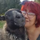 Sheep loving Amanda Gray with Gracie, one of her flock. EMN-220701-154919001