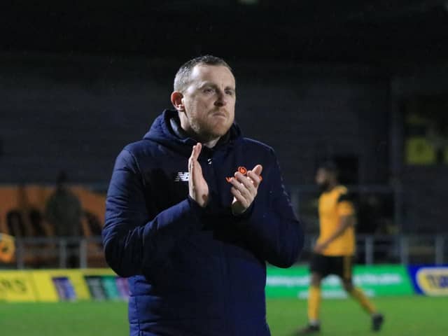 Craig Elliott applauds fans in his final game as manager. Photo: Oliver Atkin
