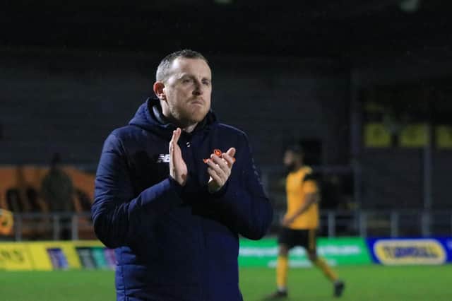 Craig Elliott applauds fans in his final game as manager. Photo: Oliver Atkin
