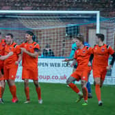 Town celebrate Lockie's leveller at Boston. Photo: Craig Harrison