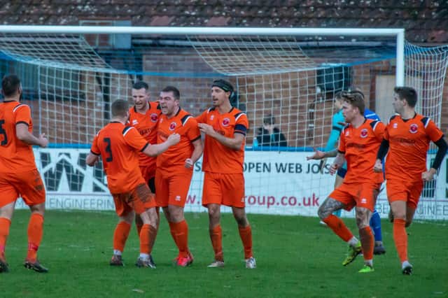 Town celebrate Lockie's leveller at Boston. Photo: Craig Harrison