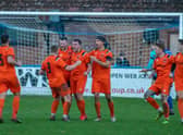 Town celebrate Lockie's leveller at Boston. Photo: Craig Harrison