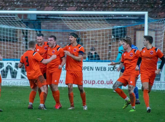 Town celebrate Lockie's leveller at Boston. Photo: Craig Harrison