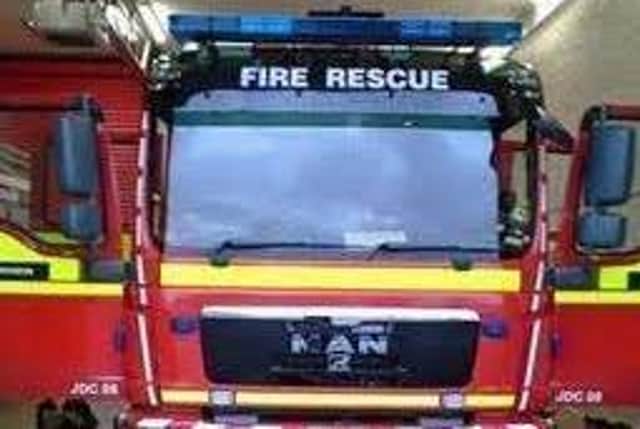 In an emergency dial 999 and ask for the fire service.