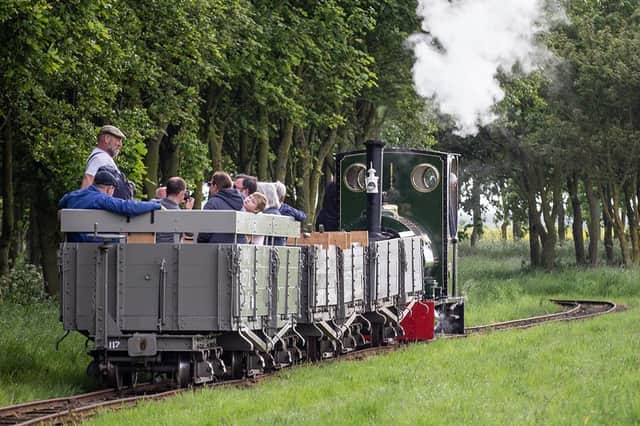 The LCLR's three Class D wagons running behind our Peckett 0-6-0ST Jurassic with the hand brake and the pipes for air braking visible on the back of converted Class D wagon 2572. This conversion was supported by the National Lottery. Photo © David Enefer/LCLR