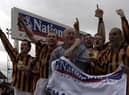 Mark Clifford (right) celebrates the 2002 title win. Photo: Nick Johnson