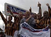 Mark Clifford (right) celebrates the 2002 title win. Photo: Nick Johnson