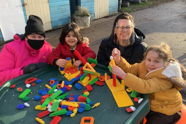 Outside with Richmond School pupils are teaching assistants Beckie Millar and Rose Pacey.