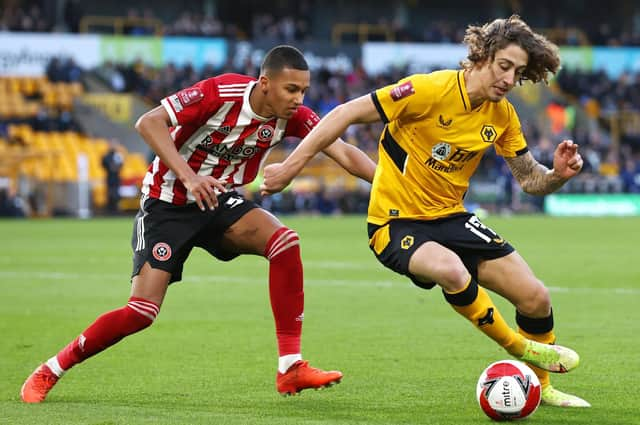 Fabio Silva of Wolverhampton Wanderers is closed down by Kyron Gordon of Sheffield United during the Emirates FA Cup third round match at Molineux. (Photo by Mark Thompson/Getty Images)