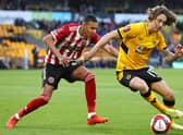Fabio Silva of Wolverhampton Wanderers is closed down by Kyron Gordon of Sheffield United during the Emirates FA Cup third round match at Molineux. (Photo by Mark Thompson/Getty Images)