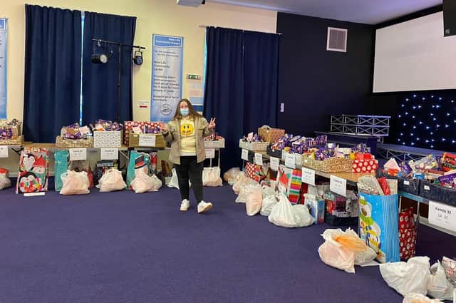 Employee Ellen Watson pictured with donations.