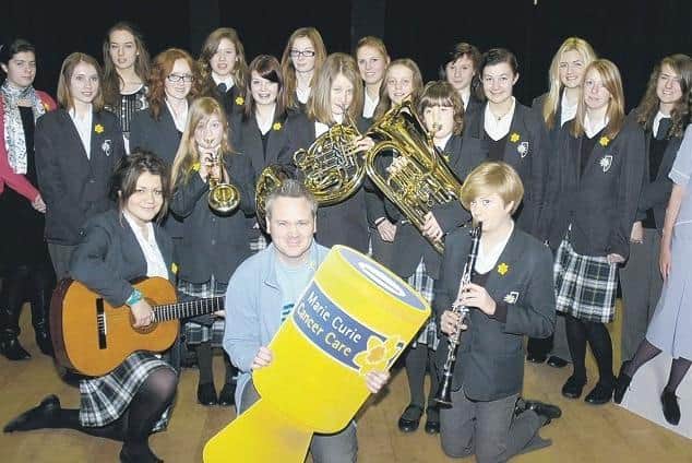 Kesteven and Sleaford High School presenting £1,000 to Stuart Wyle, Marie Curie community fundraiser.