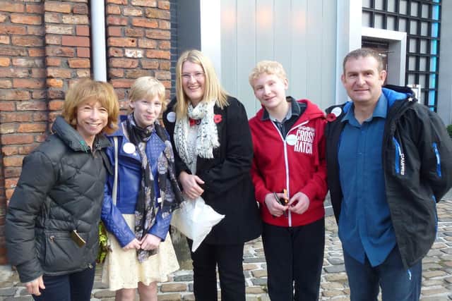 Simon Cross (right) with family including daughter Hannah meeting stars on the set of Coronation Street. EMN-220117-144854001