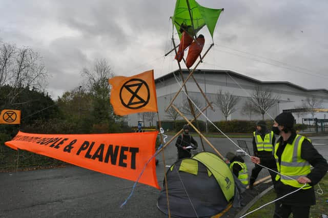 Extinction Rebellion protestors at Amazon Peterborough EMN-211126-090800009