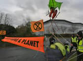 Extinction Rebellion protestors at Amazon Peterborough EMN-211126-090800009